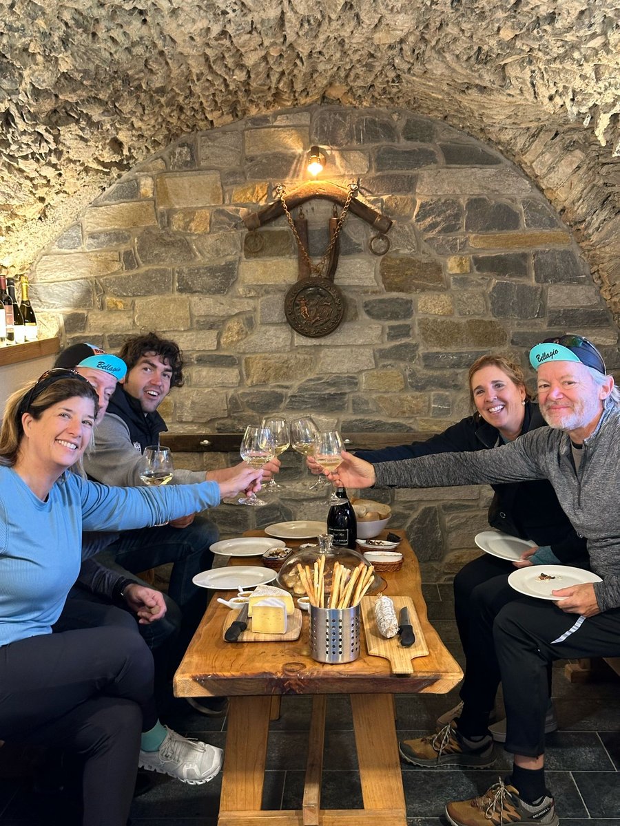 Cyclists enjoying wine and food lake como